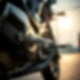 Close-up of a motorcycle chain being lubricated