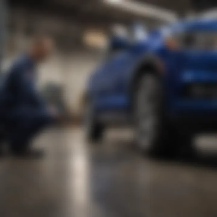 Ford service technician inspecting a vehicle