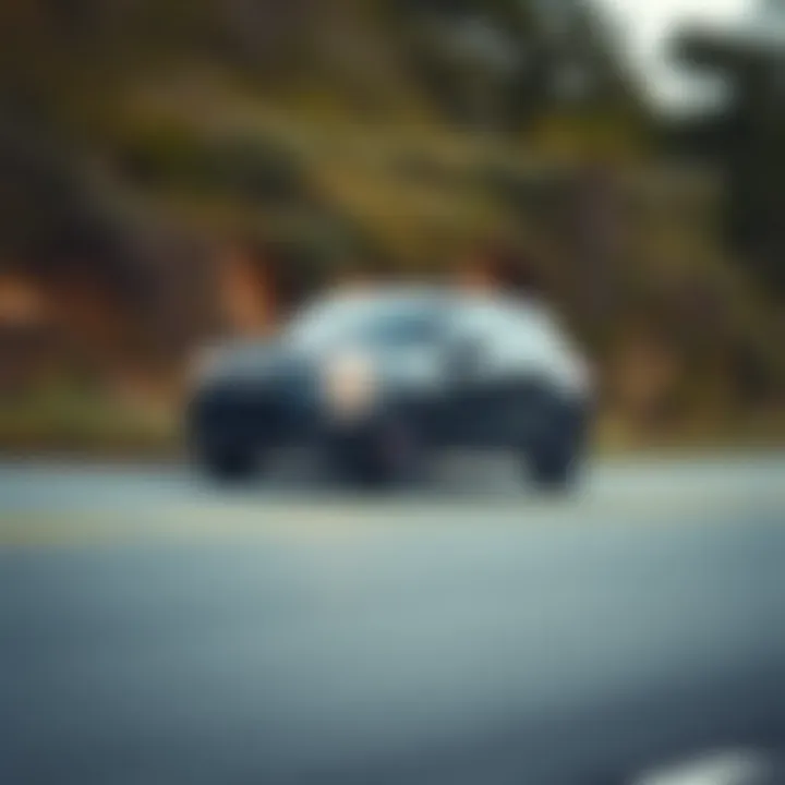 Dynamic Motion of the Black Fiat 500X Dynamic shot of the Black Fiat 500X in motion on a scenic road
