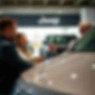 Customer Experience at Central Valley Jeep Dodge Ram Happy customers receiving keys to their new vehicle at the dealership