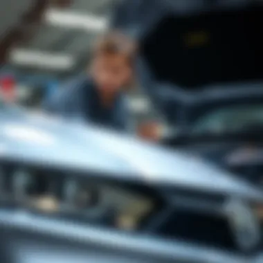 Quality Inspection of a Pre-Owned Acura Mechanic inspecting the quality of a used Acura