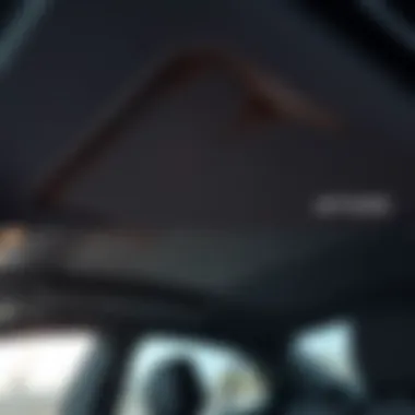 Interior view of VW Golf with worn headliner